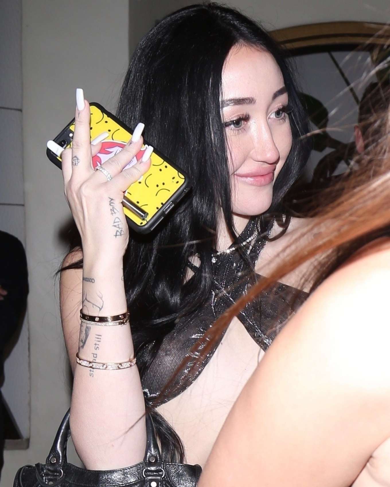 Noah Cyrus Flashes Her Assets From Beneath A Scarf Top In La