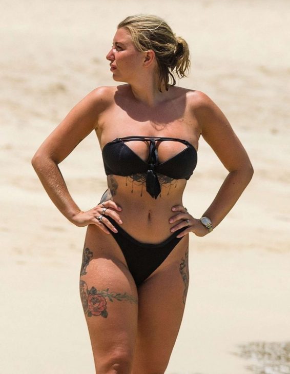 Olivia Buckland in Black Bikini on the beach in Barbados