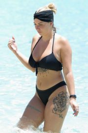 Olivia Buckland in Black Bikini with Alex Bowen on the beach in Barbados