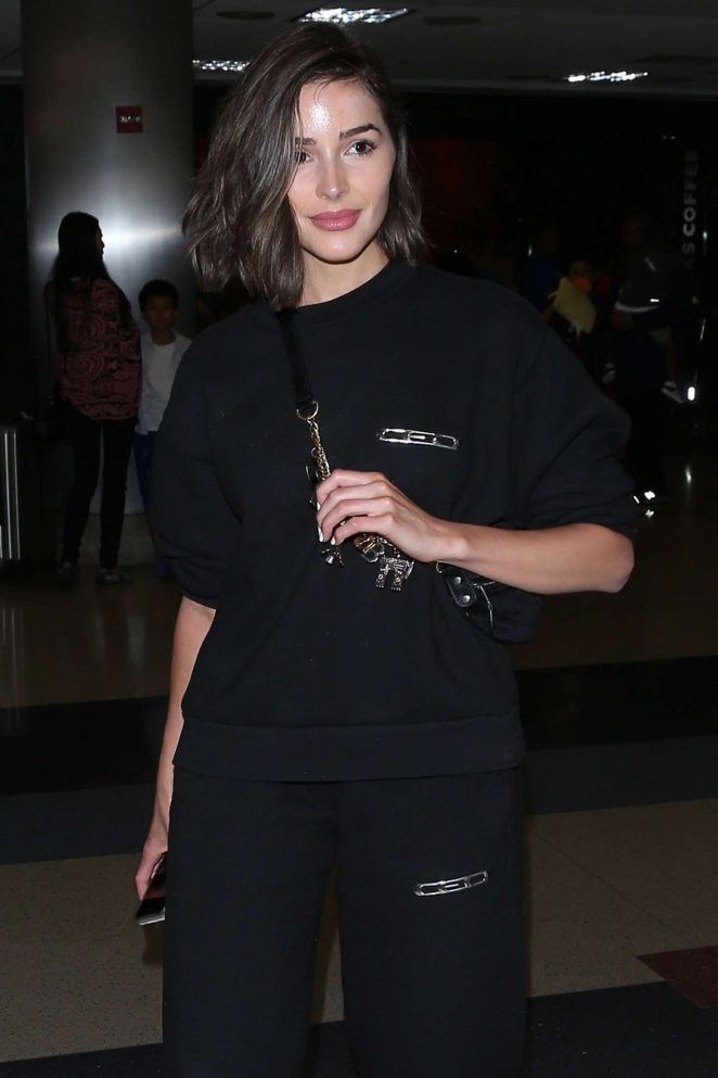 Olivia Culpo in Black - Arrives at LAX airport in Los Angeles