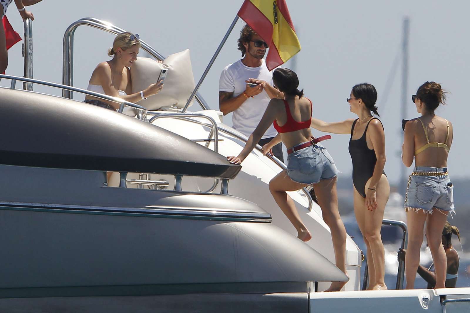 Olivia Culpo in Red Bikini on a yacht in Formentera. 