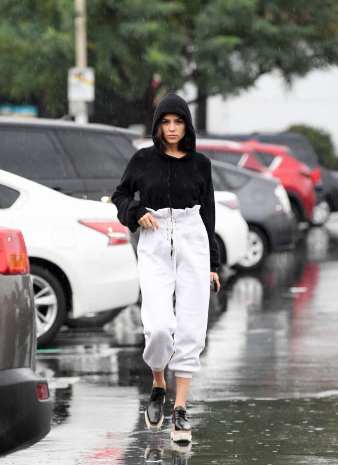 Olivia Culpo out in the rain for grocery shopping in LA