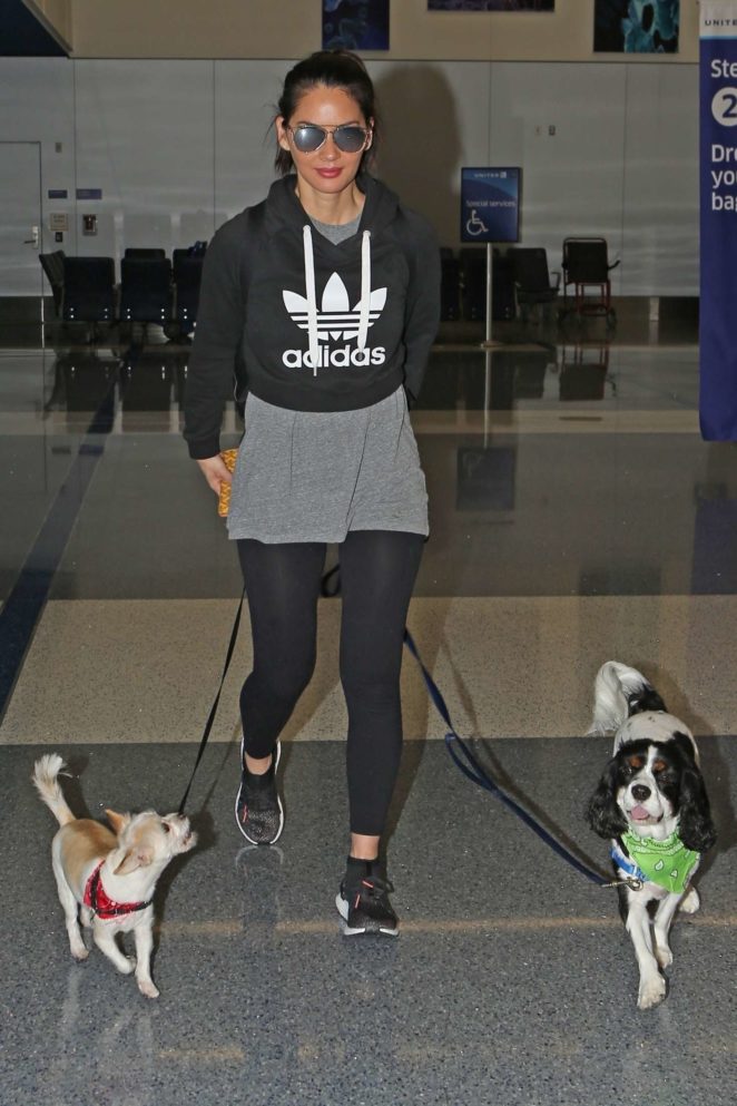 Olivia Munn with her two dogs Leaving Los Angeles