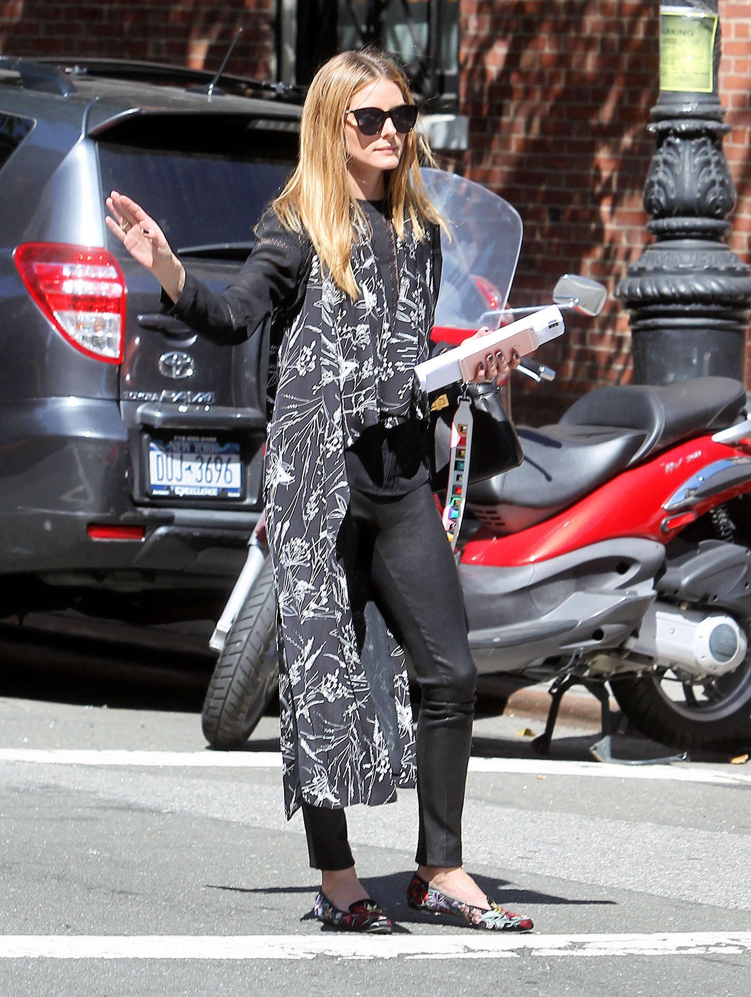Olivia Palermo hail a cab in New York City