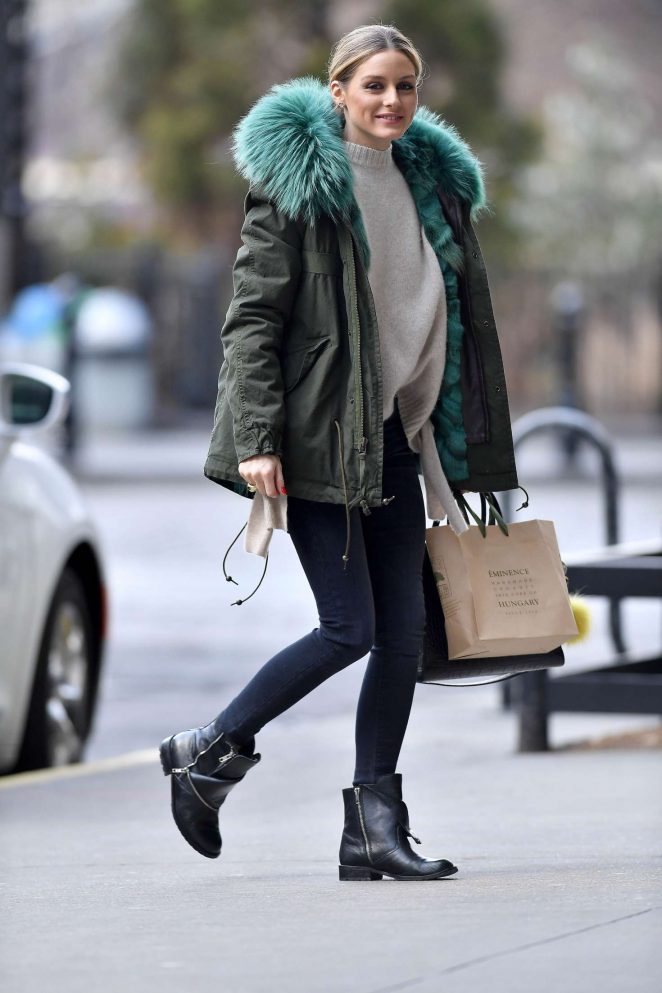 Olivia Palermo in a green jacket and black boots out in Brooklyn