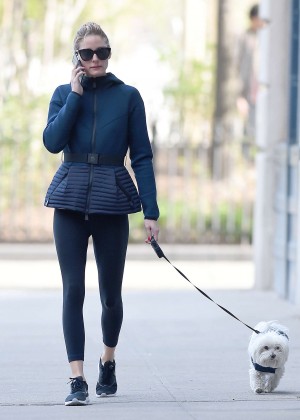 Olivia Palermo in tights walking her dog in Brooklyn