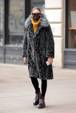 Olivia Palermo - Wearing a Cara Mila blue leopard print coat and Moncler ski boots in New York
