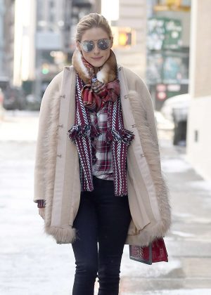 Olivia Palermo wearing a fur coat while walking in the snow in NY