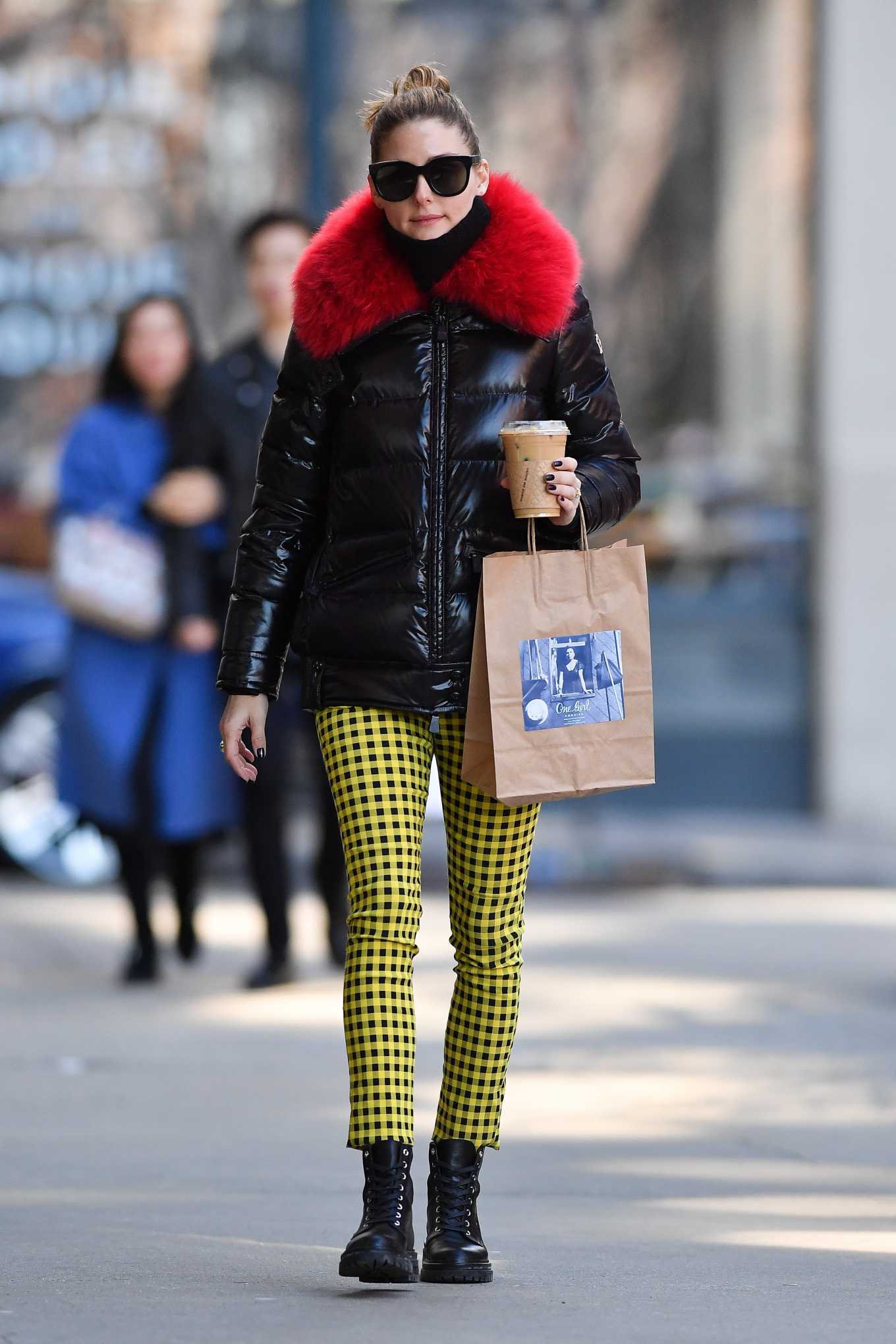 Olivia Palermo Wearing Yellow Patterned Pants With A Black Jacket
