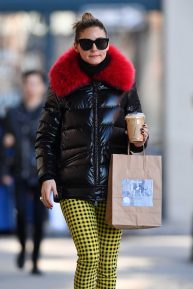Olivia Palermo - Wearing yellow patterned pants with a black jacket with red fur in Brooklyn