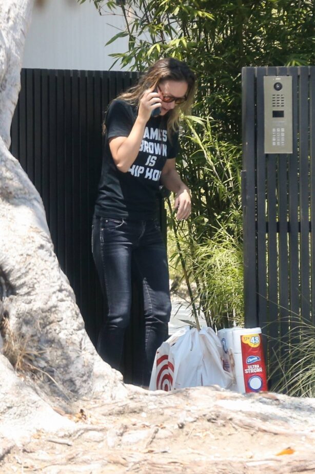 Olivia Wilde - takes a phone call outside of her home in Los Angeles
