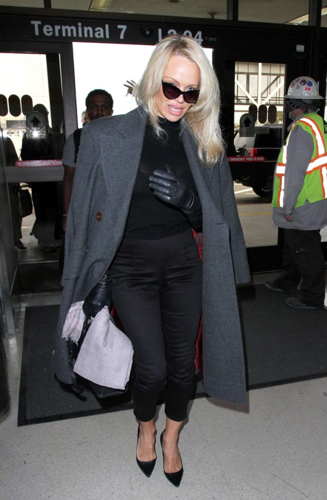 Pamela Anderson - Arrives at LAX Airport in Los Angeles