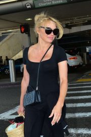 Pamela Anderson - Arrives at LAX International Airport in LA