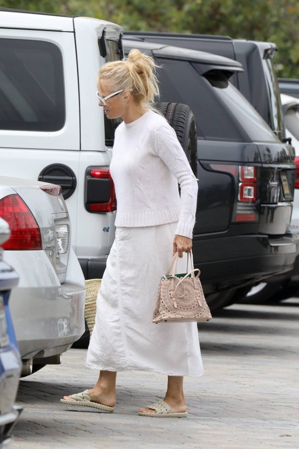 Pamela Anderson - In a white skirt as she goes shopping in Malibu