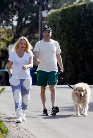 Pamela Anderson - With husband Dan Hayhurst take the dog for a walk in Malibu