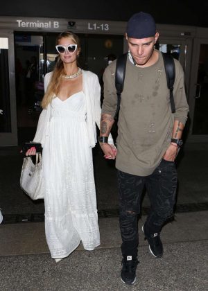 Paris Hilton and Chris Zylka at LAX Airport in LA