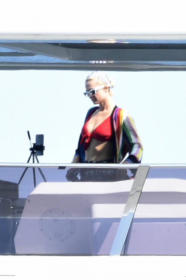 Paris Hilton - In a red bikini with fiance Carter Reum in Sardinia