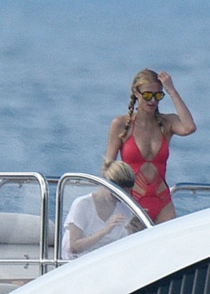 Paris Hilton in Red Swimsuit on a yacht in St. Barts