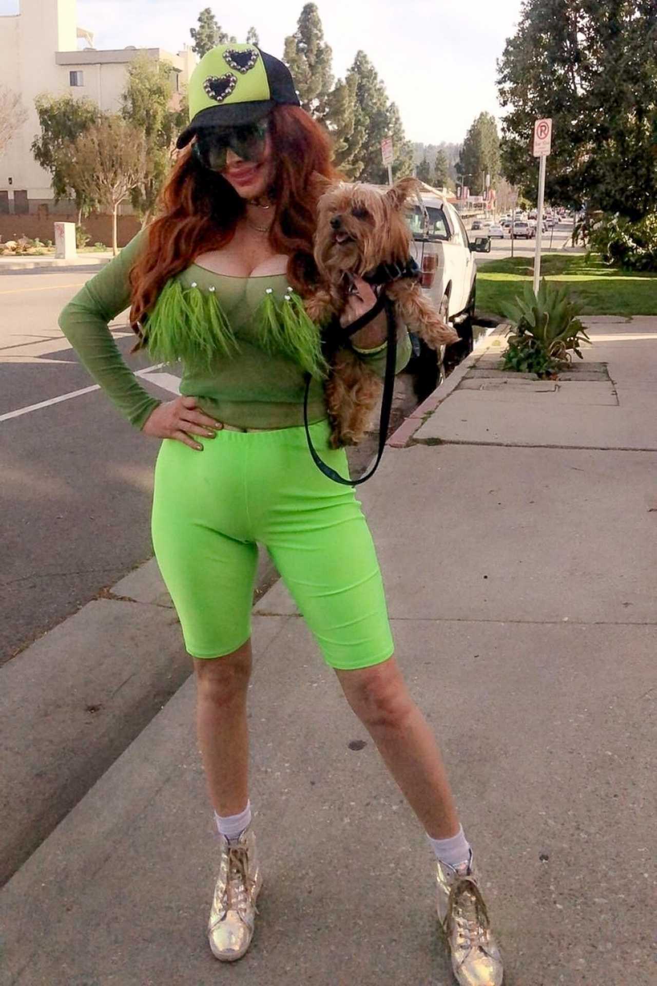 Phoebe Price â€“ In a neon green look while out walking her dog in Beverly Hills