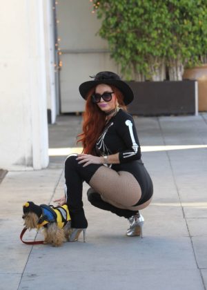 Phoebe Price in Halloween costume with her dog in Beverly Hills