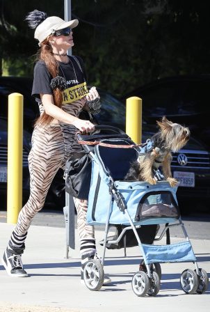Phoebe Price - On a stroll with her dog in LA