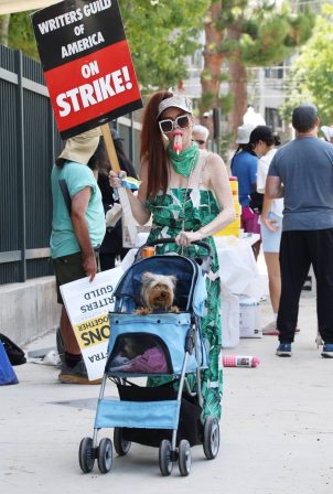 Phoebe Price - Photographed walking for the Writer's Strike in Studio City