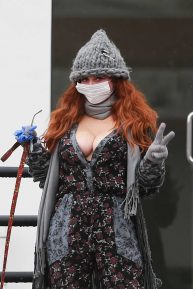 Phoebe Price wears a mask while walking her dog in Beverly Hills