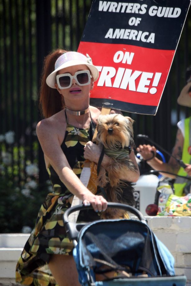 Phoebe Price - With her dog joins the protestors at Netflix on Monday in Los Angeles