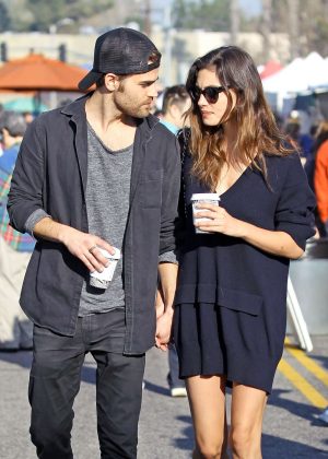 Phoebe Tonkin and Paul Wesley hold hands out in Studio City
