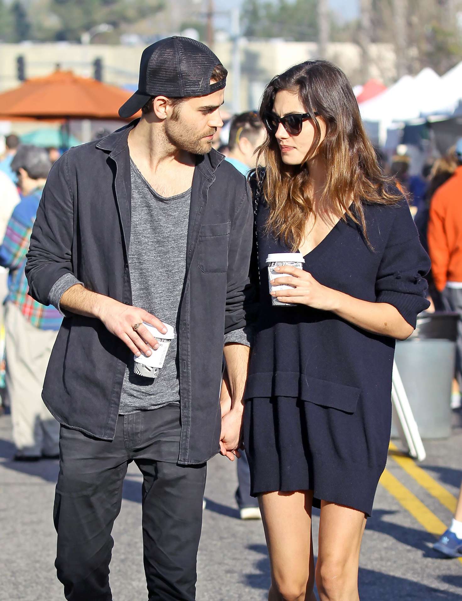 Phoebe Tonkin and Paul Wesley hold hands out in Studio City