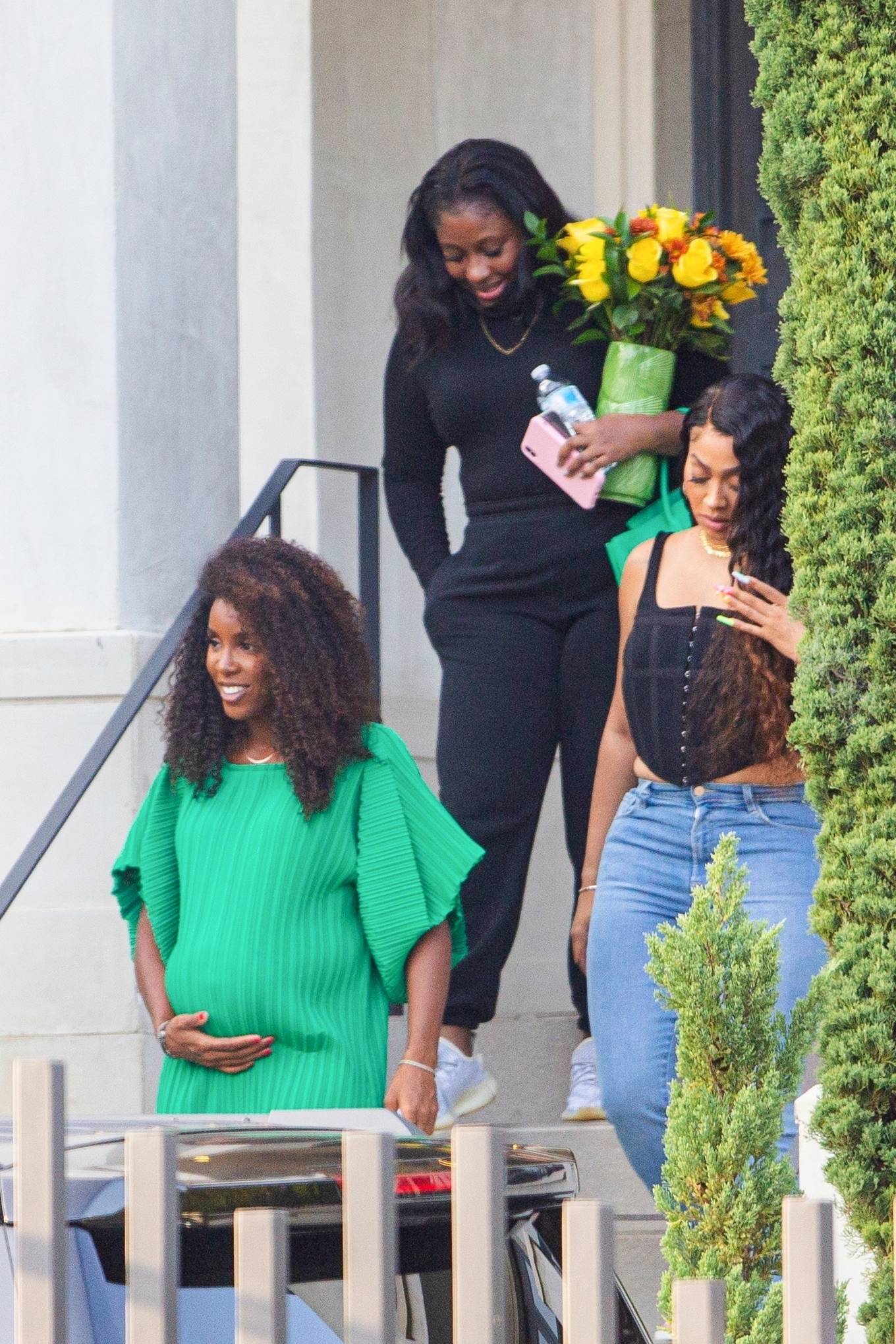 Pregnant Kelly Rowland – iI a green dress leaving a photo shoot in Brentwood