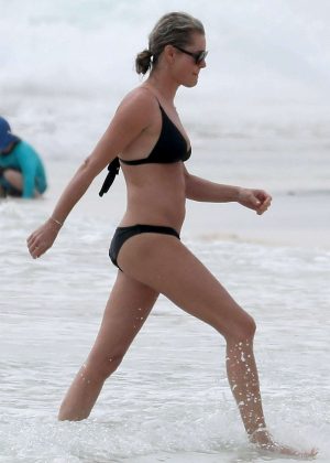 Rebecca Romijn in Black Bikini on the beach in Tulum