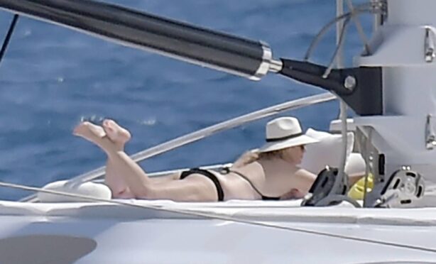 Rebel Wilson - Sunbathing on a luxury yacht in Portofino