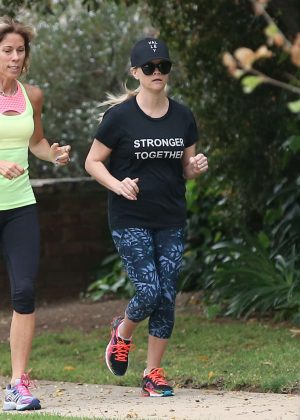 Reese Witherspoon at a jog in the rain in Brentwood