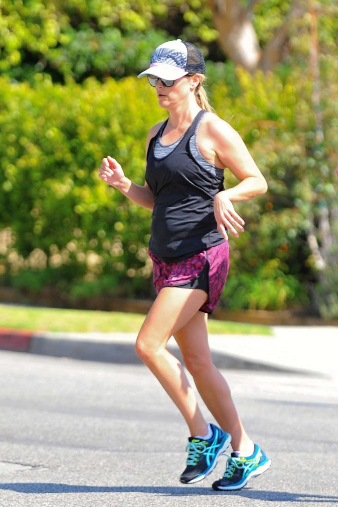 Reese Witherspoon in shorts jogging in Los Angeles