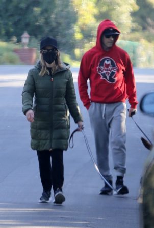 Reese Witherspoon - With her husband Jim Toth on Superbowl Sunday in Brentwood