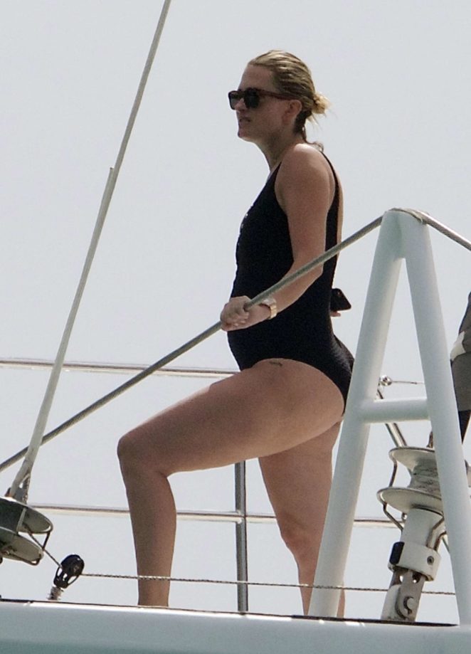 Rhea Durham in Black Swimsuit on a yacht in Barbados