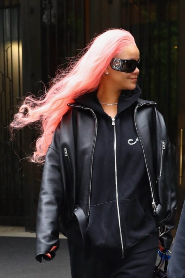 Rihanna - Dons pink hair as she heads to the airport in New York