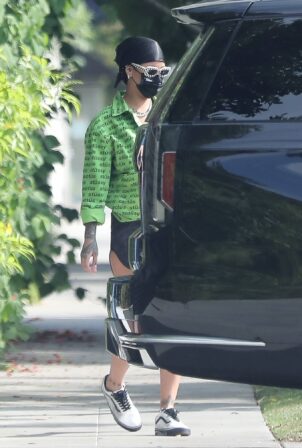 Rihanna – Donss a green Stussy and Van's shoes in Santa Monica | GotCeleb