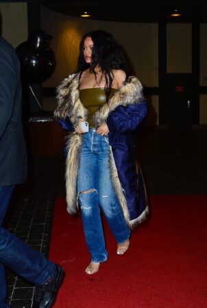 Rihanna -In a coat paired with jeans while out for dinner in NYC