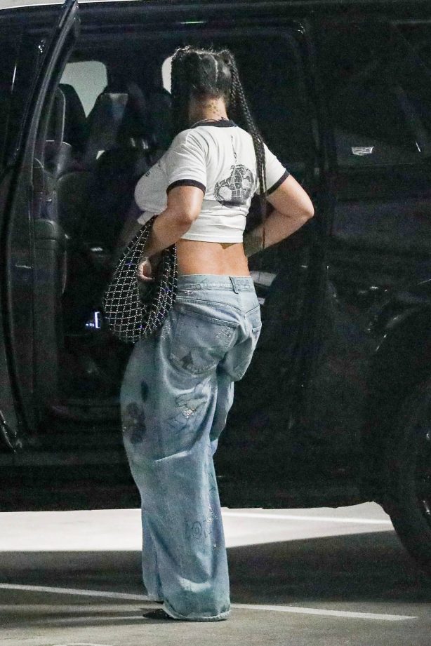 Rihanna - In a Rage Against The Machine tee at a parking garage in Beverly Hills