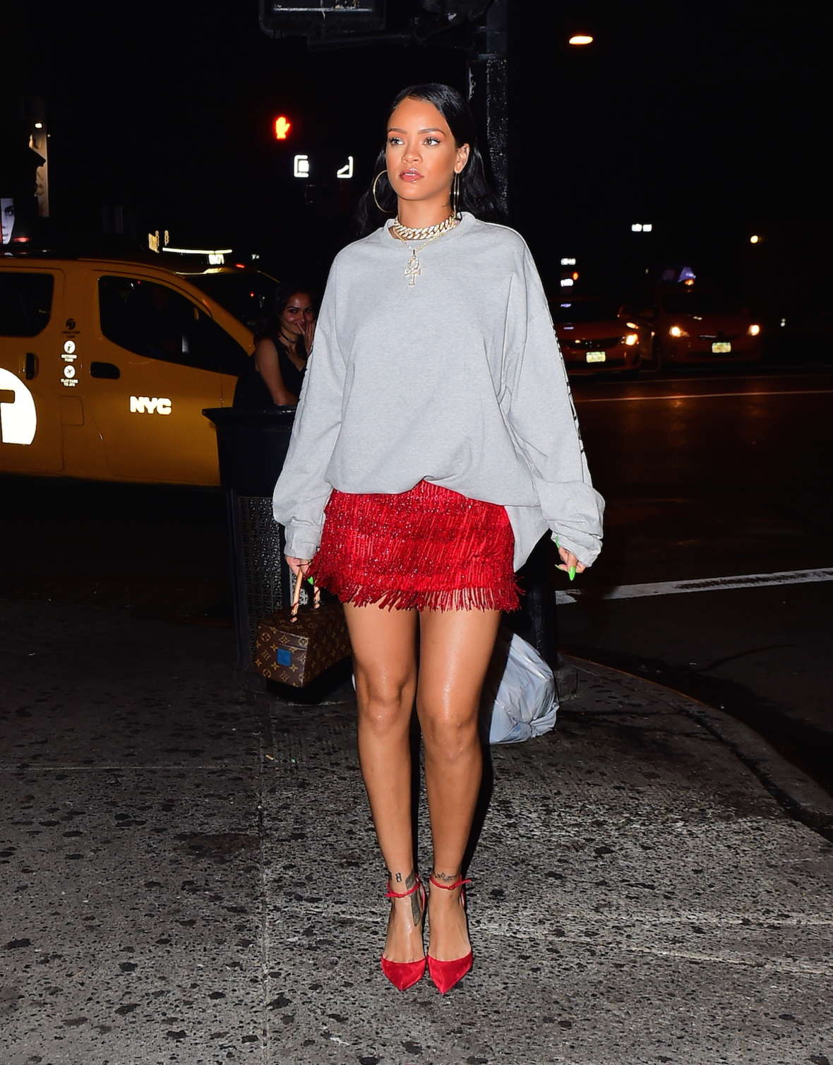 Rihanna in a red fringed skirt at Avenue Nightclub -16 - GotCeleb