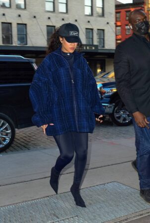 Rihanna - Out an oversized blue plaid coat on a lunch outing in New York