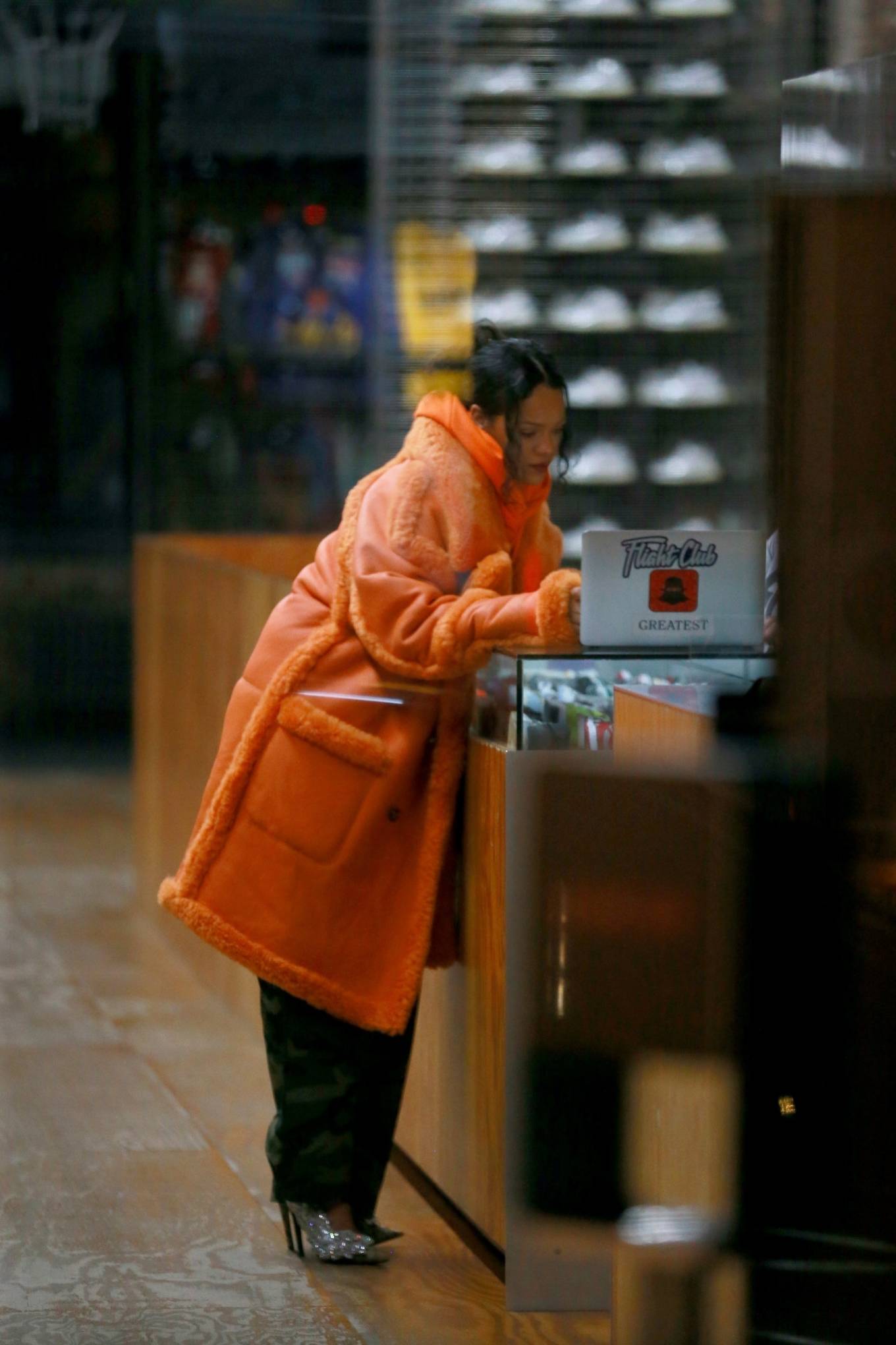 Rihanna 2022 : Rihanna – Out in a furry orange coat for a shopping at Flight Club shoe store in New York-07