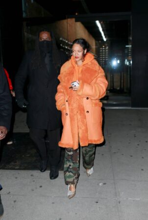 Rihanna - Out in a furry orange coat for a shopping at Flight Club shoe store in New York