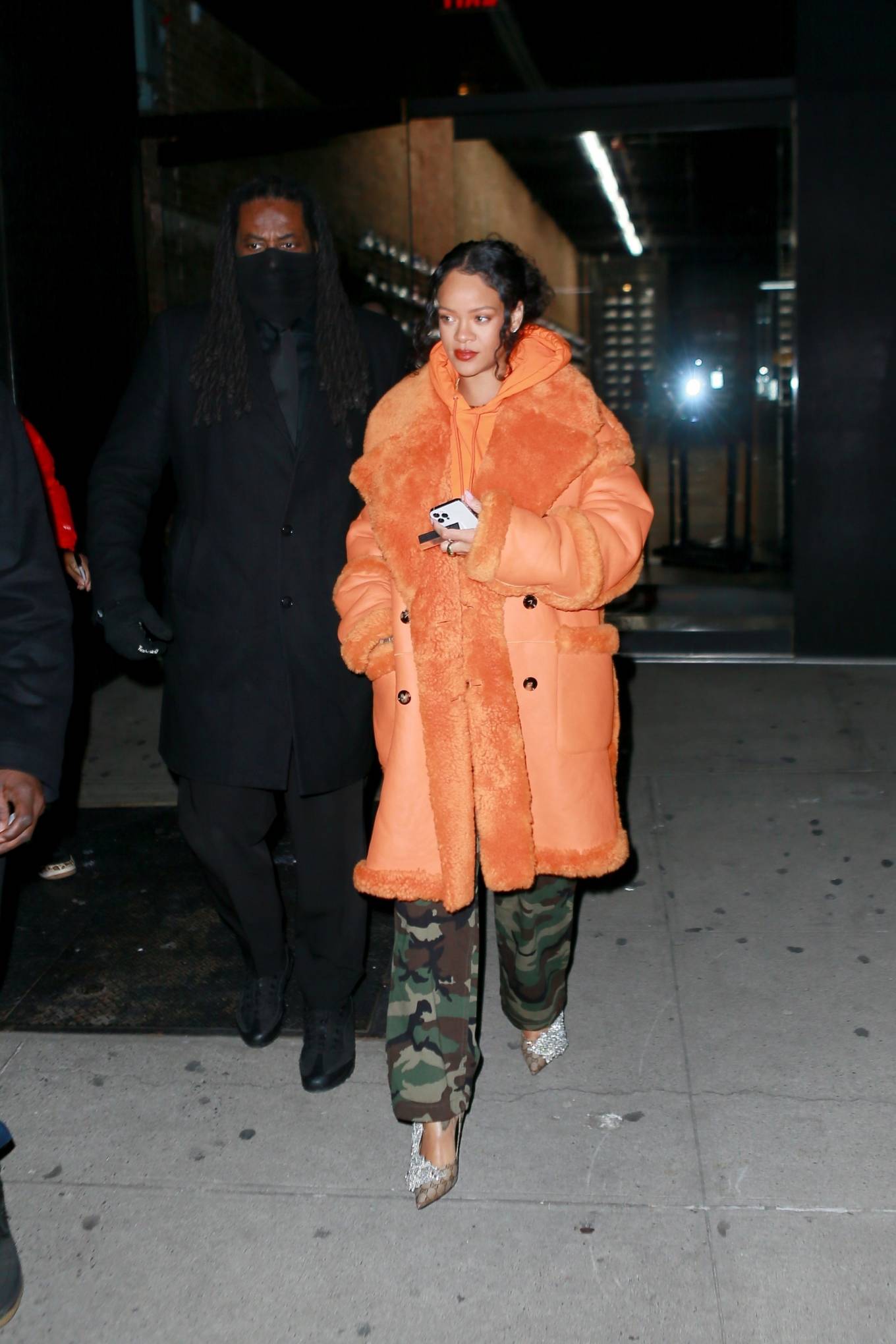 Rihanna - Out in a furry orange coat for a shopping at Flight Club shoe store in New York