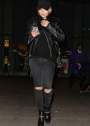 Rita Ora in Ripped Jeans at Heathrow airport in London