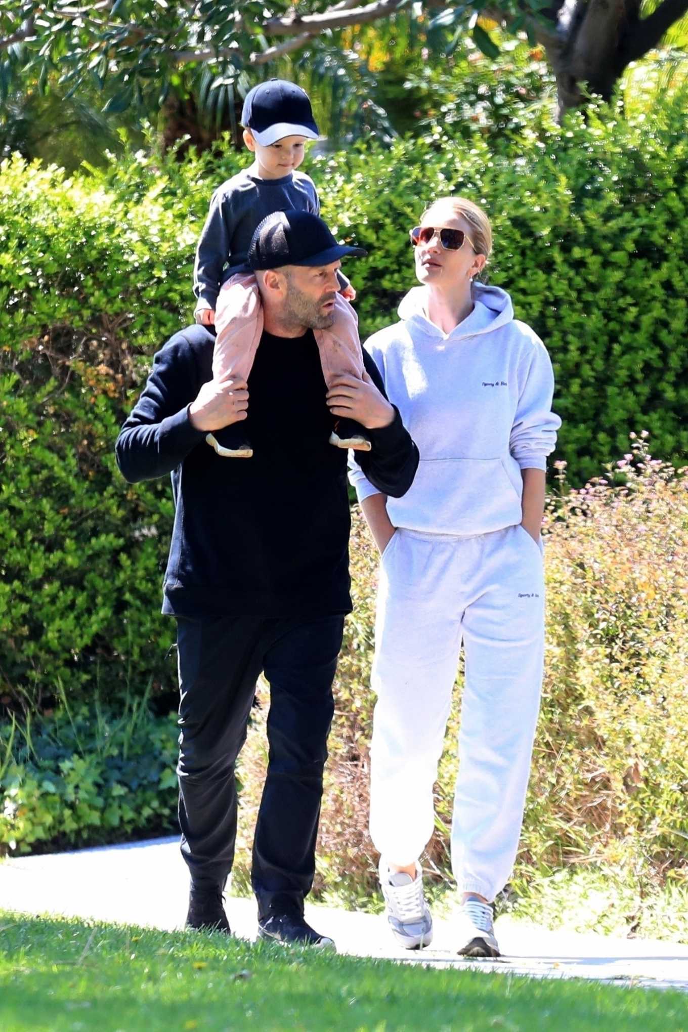 Rosie Huntington-Whiteley â€“ Out for a walk with a family in Beverly Hills