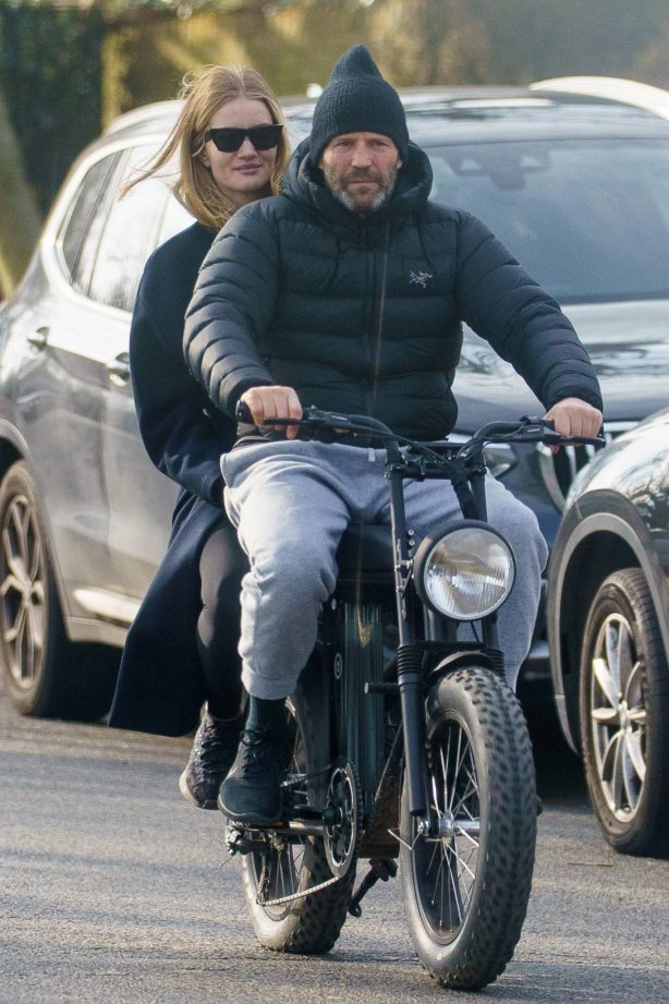 Rosie Huntington-Whiteley - With Jason Statham ride electric bike in London