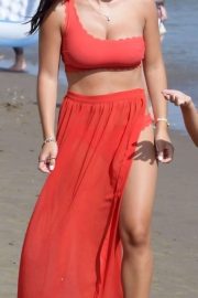 Sadie Wright in Red Bikini and Skirt on the beach in Marbella